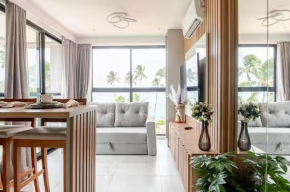 Flat pé na areia e vista mar